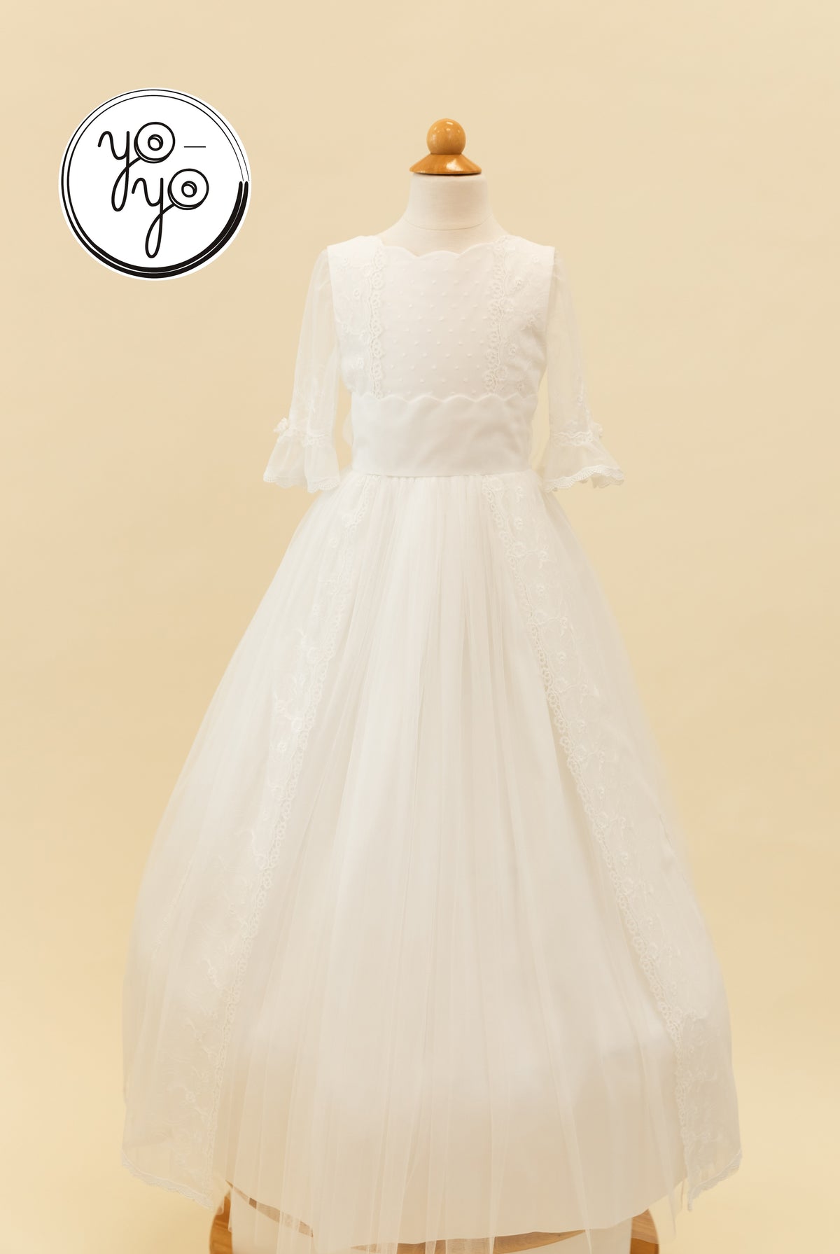 YoYo Boutique Senna Dress: a white floor-length French tulle Communion gown with a scalloped neckline, three-quarter sleeves, and lace trim.