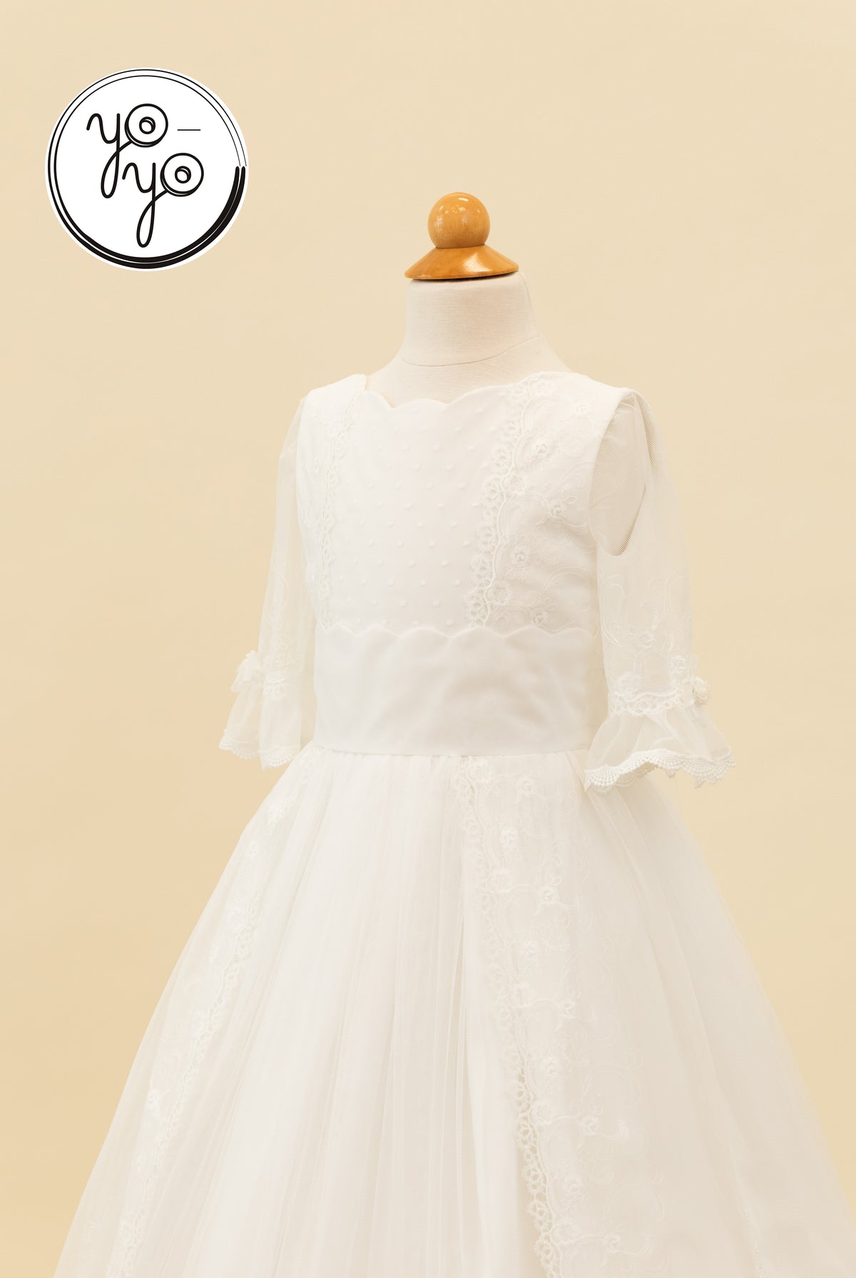White boho Senna Dress with a scalloped neckline, three-quarter lace sleeves, and a tulle skirt with lace trim.