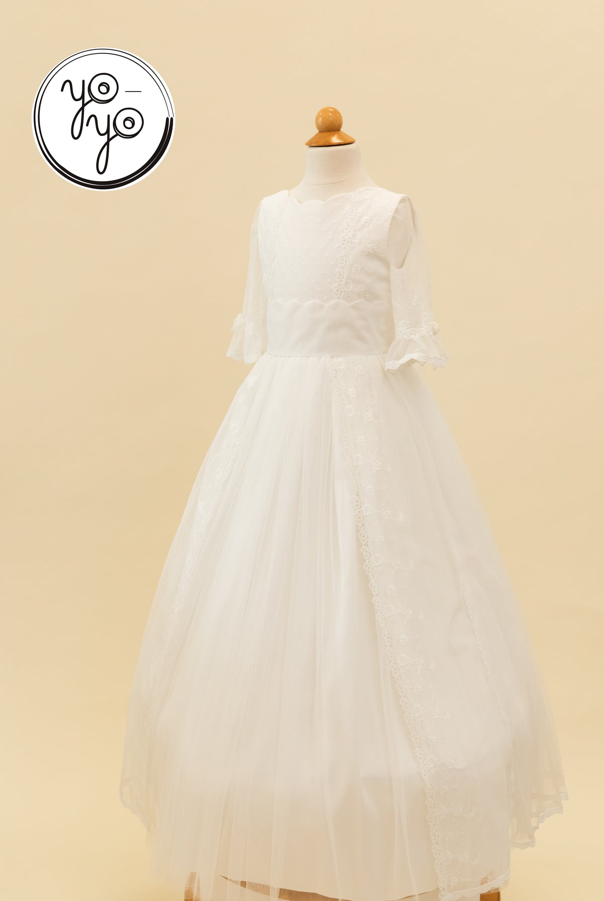 White Senna boho dress with a scalloped neckline, three-quarter lace sleeves, and a layered French tulle skirt.