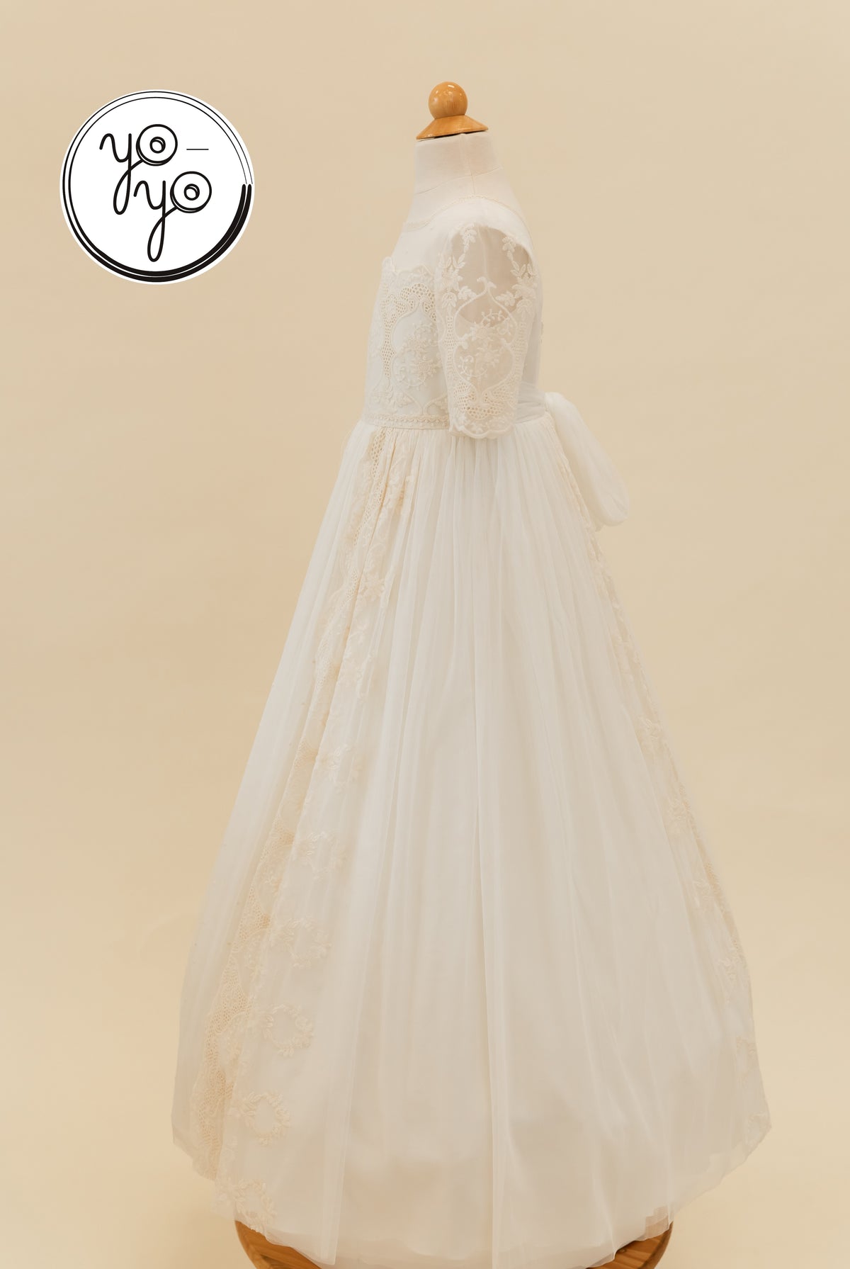 Pino Dress: a white long-sleeved First Communion gown featuring an embroidered lace bodice and a sheer, floor-length tulle skirt.