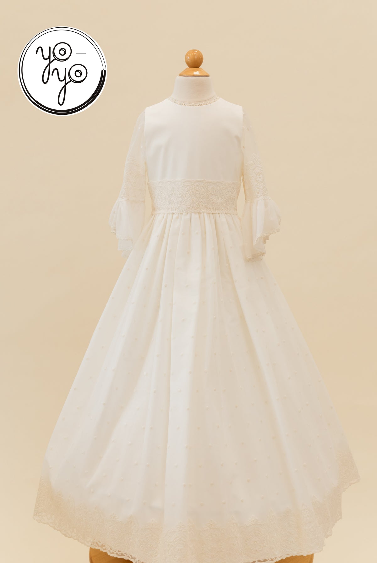 Mannequin wearing the YoYo Boutique Manon dress, featuring three-quarter bell sleeves, a lace-trimmed waist, and a long skirt with a lace hem.