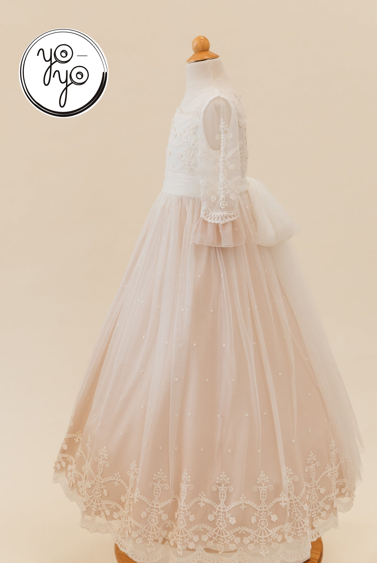Lua Dress: Floor-length, A-line First Communion dress with a lace bodice, 3/4 lace sleeves, and a dusty rose tulle skirt with an embroidered hem.