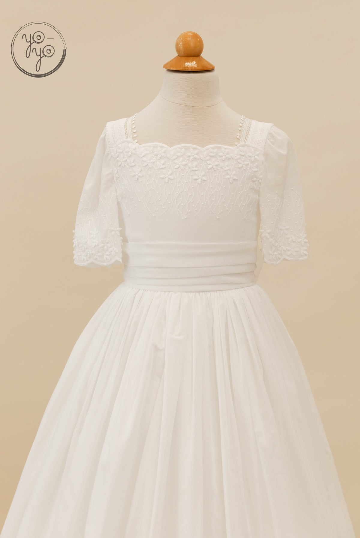 YoYo Boutique Salvia dress in white, featuring a square neckline, short sleeves, and floral embroidery on the bodice and sleeve cuffs.