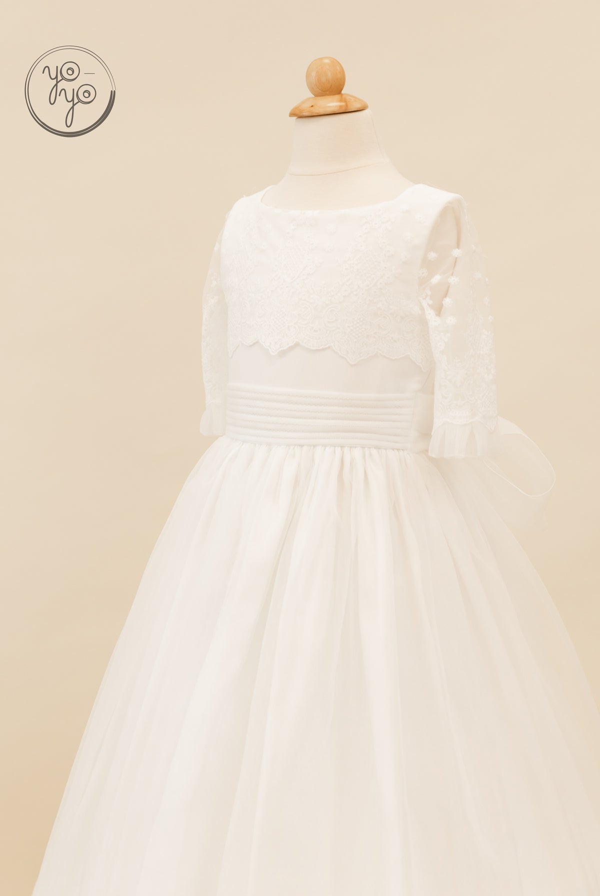 Campanilla Dress: white sleeveless boho gown with an embroidered floral lace bodice, gathered waist, and layered tulle skirt.