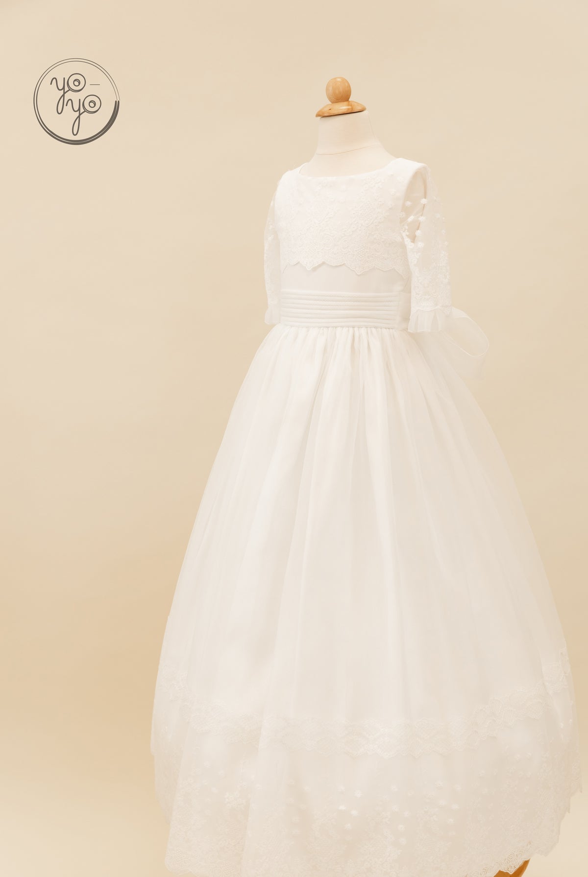 Campanilla dress: white boho A-line gown featuring a lace bodice, three-quarter sleeves, a banded waist, and a floor-length tulle skirt.